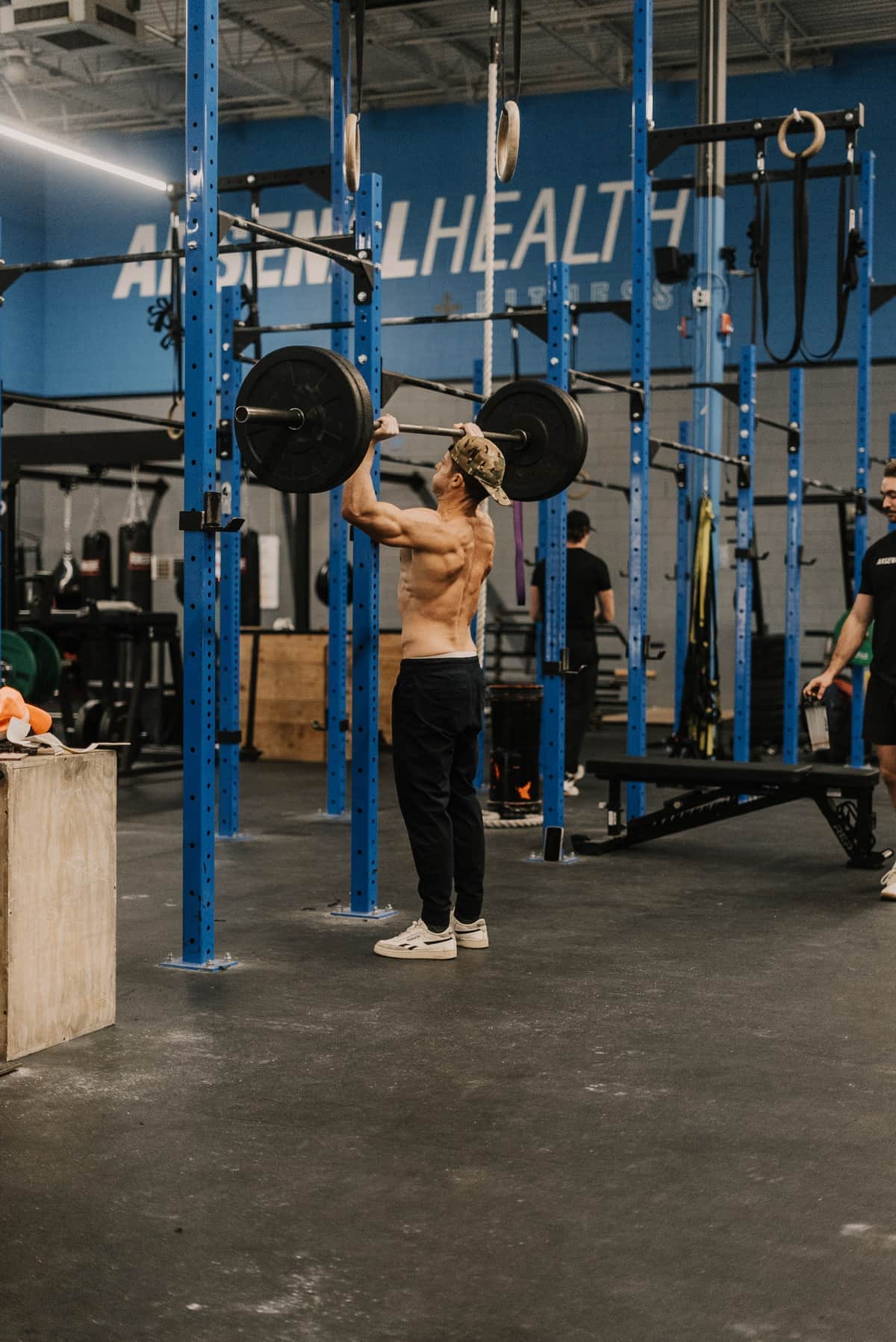 Arsenal Health member training with weights in premium facility